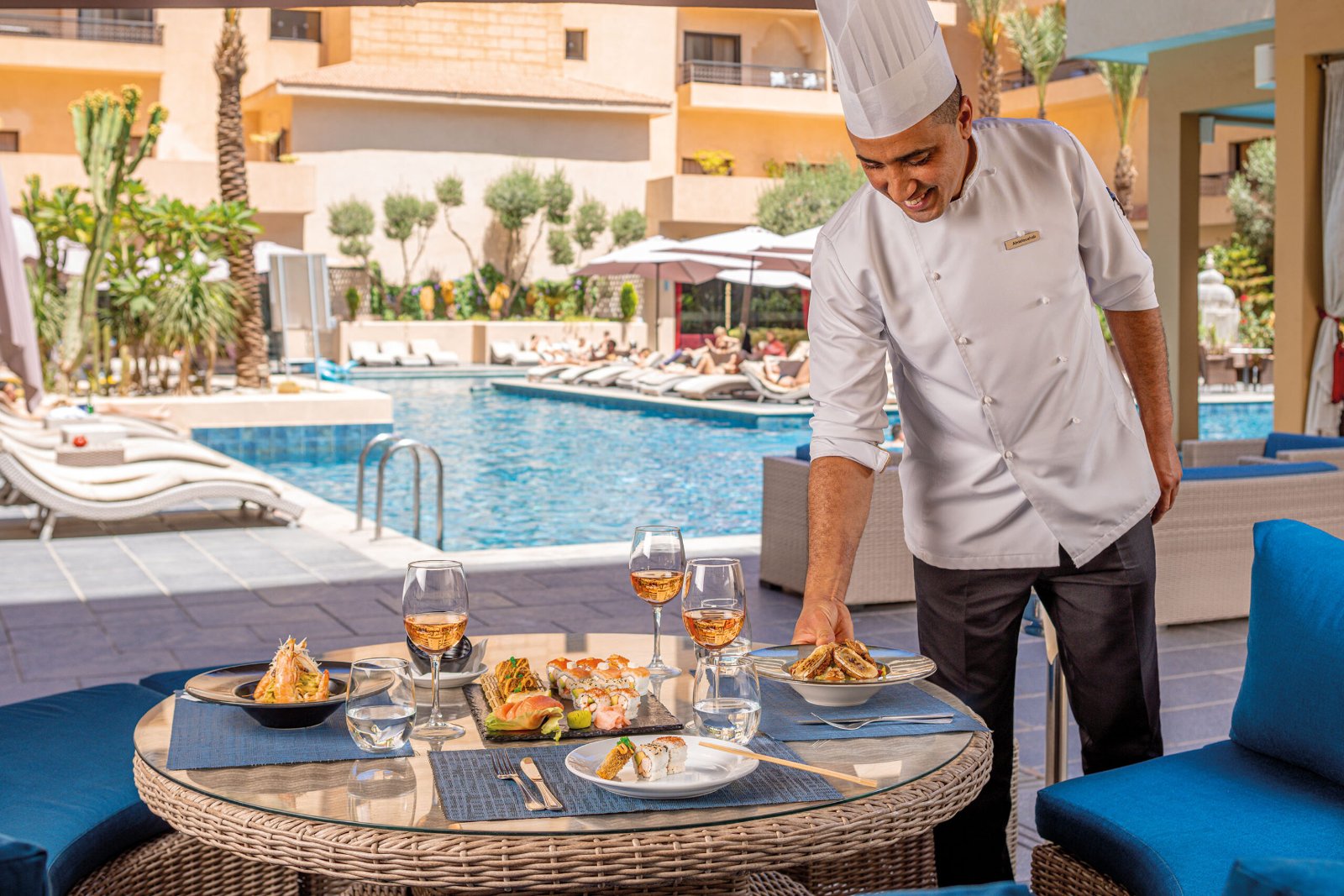 Outdoor swimming pool and poolside restaurant at the Grand Plaza Marrakech hotel